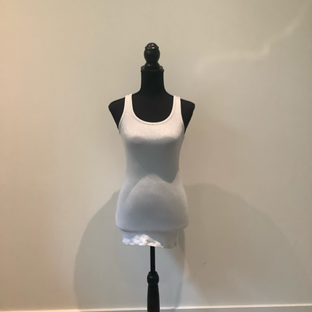 a.n.d beautiful elegant tank top is in perfect condition.